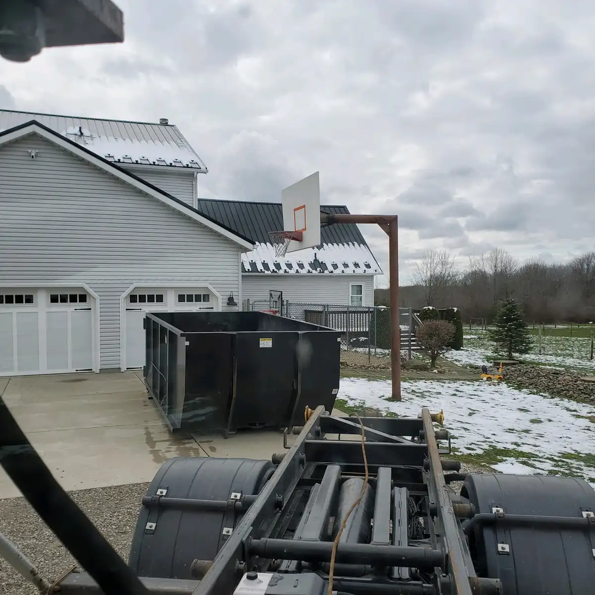 20-yard dumpster delivered to a residential driveway in Northeast Ohio